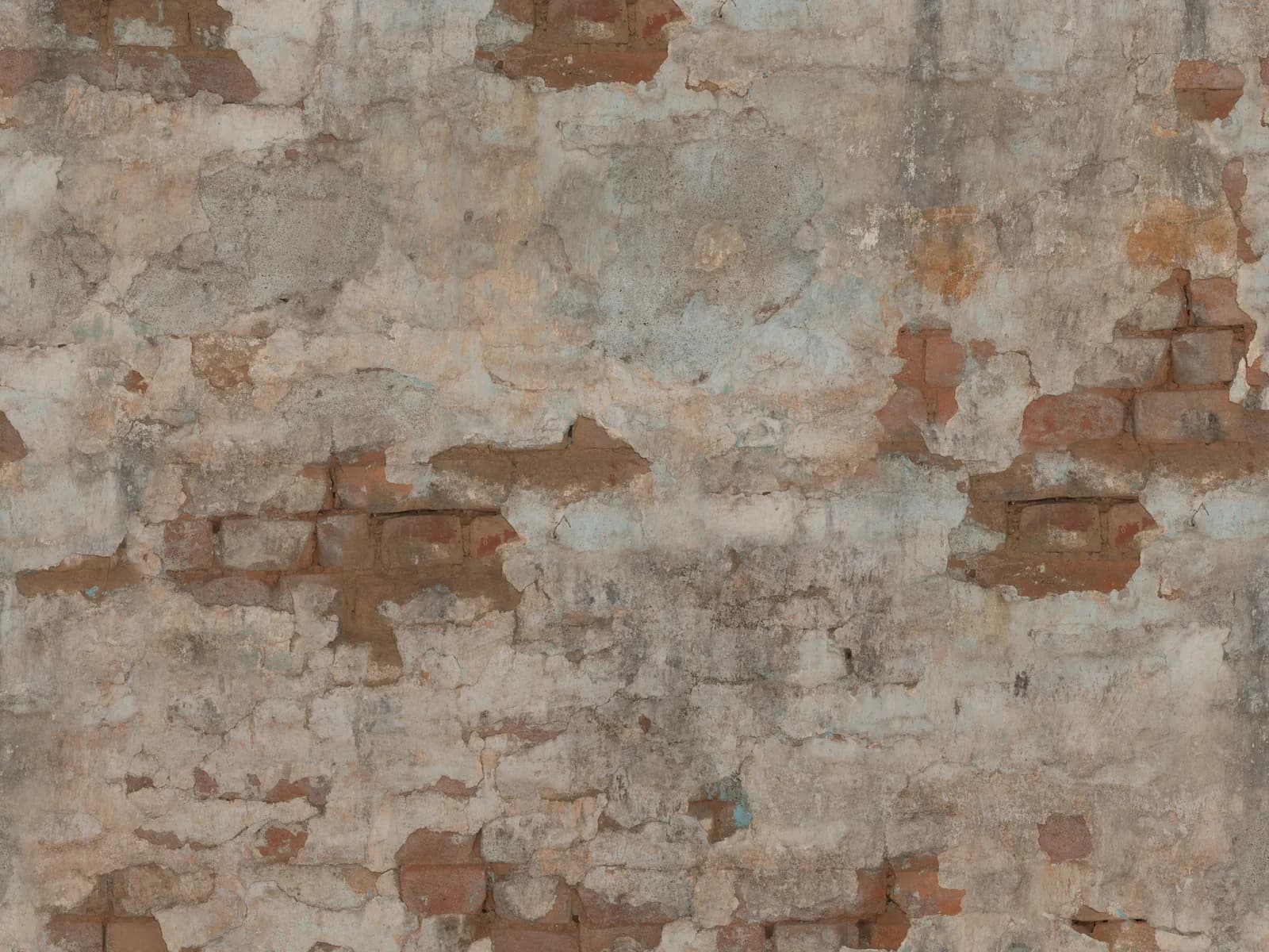 Deteriorated plaster with the brick masonry showing through